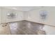 Bright and airy living room with new flooring and ample space for furnishings at 20530 Randolph Pl, Denver, CO 80249