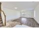 Bright living room featuring new hardwood floors and plenty of natural light, perfect for renovation at 20530 Randolph Pl, Denver, CO 80249