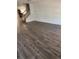 Spacious living room featuring hardwood floors, a staircase, and freshly painted white walls at 20530 Randolph Pl, Denver, CO 80249