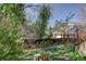 Backyard with wooden fence, flowers, and trees at 1460 Quince Ave # 102, Boulder, CO 80304