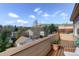 Outdoor balcony space with seating and a view of trees and other homes at 1460 Quince Ave # 102, Boulder, CO 80304