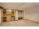 Finished basement featuring a wet bar with a mini-fridge and a built-in closet with bench seating at 1460 Quince Ave # 102, Boulder, CO 80304