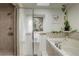 Bathroom featuring a soaking tub with shower and picturesque window at 1460 Quince Ave # 102, Boulder, CO 80304