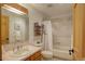 Standard full bathroom featuring a tub/shower combo, and a wood vanity with plenty of counter space at 1460 Quince Ave # 102, Boulder, CO 80304