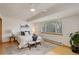 Bright bedroom with neutral decor, large window, ceiling fan and light hardwood floors at 1460 Quince Ave # 102, Boulder, CO 80304