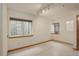 Bright bedroom with two windows, featuring neutral walls and track lighting at 1460 Quince Ave # 102, Boulder, CO 80304
