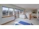 Bright bonus room with lots of natural light, a ceiling fan, and sliding glass doors to a deck at 1460 Quince Ave # 102, Boulder, CO 80304