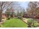 Exterior of building with trees and green lawn at 1460 Quince Ave # 102, Boulder, CO 80304
