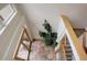Foyer featuring tile floor, indoor garden, and wood and glass staircase at 1460 Quince Ave # 102, Boulder, CO 80304
