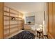 Comfortable office space with built-in bookshelves, a white chair, and a window, perfect for working from home at 1460 Quince Ave # 102, Boulder, CO 80304