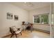 Bright home office with wooden floors, large window, desk, and comfortable seating at 1460 Quince Ave # 102, Boulder, CO 80304