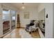 Cozy sitting area with comfortable chair, sliding glass doors, and stylish decor at 1460 Quince Ave # 102, Boulder, CO 80304