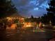 Evening view of deck with firepit and gazebo at 10037 Allison Ct, Broomfield, CO 80021