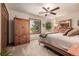 Charming bedroom with large windows and a dresser at 10037 Allison Ct, Broomfield, CO 80021