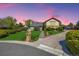 Charming home with lush landscaping, stone accents, and a well-manicured lawn against a beautiful sky at 10037 Allison Ct, Broomfield, CO 80021