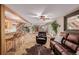 Gathering room with stone floors, leather furniture and a wet bar at 10037 Allison Ct, Broomfield, CO 80021