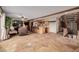 Gathering room with stone floors, a wet bar, and a large screen TV at 10037 Allison Ct, Broomfield, CO 80021