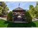 A charming gazebo with string lights and seating at 10037 Allison Ct, Broomfield, CO 80021
