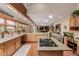 Large kitchen with center island, wood cabinets, and granite countertops at 10037 Allison Ct, Broomfield, CO 80021