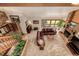 Spacious living room with a leather sectional sofa and a large stone fireplace at 10037 Allison Ct, Broomfield, CO 80021