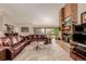 Living room with fireplace, large windows, and comfortable seating at 10037 Allison Ct, Broomfield, CO 80021