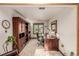 Home office with built-in wooden shelving and a large desk at 10037 Allison Ct, Broomfield, CO 80021