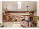 Upper level sitting area with a comfortable brown chair and a skylight at 10037 Allison Ct, Broomfield, CO 80021