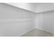 Spacious walk-in closet featuring ample hanging storage, perfect for organization at 1697 S Andes Way, Aurora, CO 80017