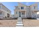 Charming townhouse featuring stone accents, a covered front porch, and inviting curb appeal at 1697 S Andes Way, Aurora, CO 80017