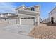 Exterior view of the garage and driveway, enhancing curb appeal at 1697 S Andes Way, Aurora, CO 80017