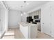 Stylish kitchen featuring an island with seating and sink, modern appliances, and ample counter space at 1697 S Andes Way, Aurora, CO 80017