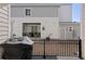 Private patio area with black iron railing, offering space for outdoor dining and relaxing at 1697 S Andes Way, Aurora, CO 80017