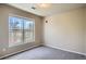 Bedroom with large windows and grey carpet offers great light and a cozy feel at 8083 W 51St Pl # 203, Arvada, CO 80002