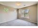 Bright bedroom with neutral carpet, multiple windows, and ample natural light at 8083 W 51St Pl # 203, Arvada, CO 80002