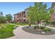 Charming multi-story condo building featuring manicured landscaping and inviting common areas at 8083 W 51St Pl # 203, Arvada, CO 80002