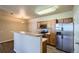 Modern kitchen with stainless steel appliances and convenient breakfast bar at 8083 W 51St Pl # 203, Arvada, CO 80002