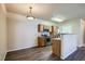 Well-appointed kitchen and dining space featuring stainless appliances and wood-look floors at 8083 W 51St Pl # 203, Arvada, CO 80002