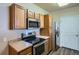 Well-equipped kitchen with stainless steel appliances, and wood-look flooring at 8083 W 51St Pl # 203, Arvada, CO 80002
