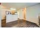 Open-concept living area flowing into the kitchen, featuring modern wood floors at 8083 W 51St Pl # 203, Arvada, CO 80002