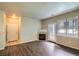 Inviting living room with wood floors, fireplace, and lots of natural light at 8083 W 51St Pl # 203, Arvada, CO 80002