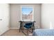 Bright bedroom featuring a writing desk, ample natural light, and a cozy ambiance offering a functional and comfortable space at 6002 E 29Th Ave, Denver, CO 80207