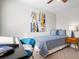 Cozy bedroom featuring a writing desk, comfortable bed, and ample natural light creating a functional and inviting space at 6002 E 29Th Ave, Denver, CO 80207