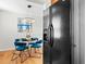 Bright dining area featuring a round table with modern chairs and a stylish light fixture, perfect for cozy meals at 6002 E 29Th Ave, Denver, CO 80207