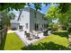 Landscaped backyard featuring a paved patio with outdoor dining and seating at 13132 Pennsylvania Cir, Thornton, CO 80241