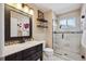Bathroom featuring a vanity, shower, and decorative shelving at 13132 Pennsylvania Cir, Thornton, CO 80241
