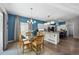 Inviting dining area adjacent to the kitchen, featuring a glass-top table and natural light at 13132 Pennsylvania Cir, Thornton, CO 80241