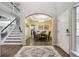 Foyer featuring staircase, chandelier lighting, rug, and wood flooring at 13132 Pennsylvania Cir, Thornton, CO 80241