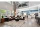 Spacious living room featuring high ceilings, large windows, and an open floor plan at 13132 Pennsylvania Cir, Thornton, CO 80241