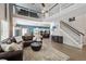 Open-concept living space with a view of the kitchen, dining area, and staircase at 13132 Pennsylvania Cir, Thornton, CO 80241