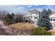 Rear exterior view of home with a backyard featuring a deck with stairs at 4300 W 105Th Pl, Westminster, CO 80031